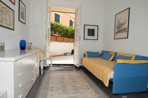 a bedroom with a bed and a desk and a window at Corsini House in Levanto