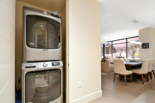 a microwave sitting on top of a dishwasher in a kitchen at Lift Park City Condominiums in Park City
