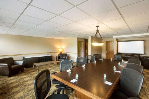 a conference room with a large wooden table and chairs at Exton Hotel and Conference Center in Exton