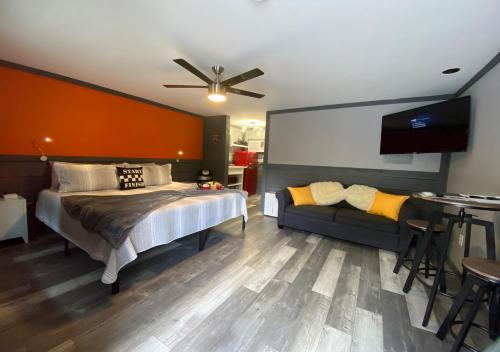 a bedroom with a bed and a couch at Dragon City in Maryville