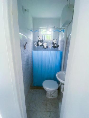 a bathroom with a toilet and a sink at hayway sustentável in Mendes