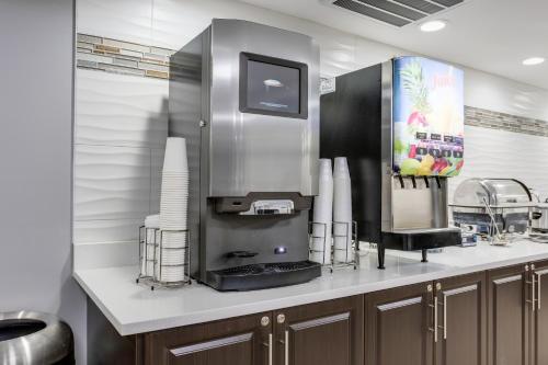a kitchen with a coffee machine on a counter at Quality Inn Kodak Sevierville in Kodak