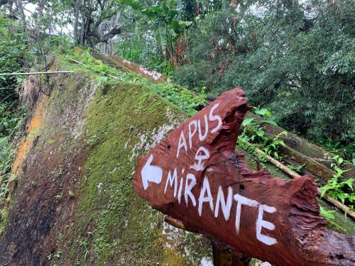 a sign on the side of a hill at hayway sustentável in Mendes