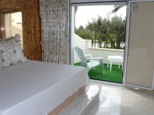 Ліжко або ліжка в номері Hotel Villaclara