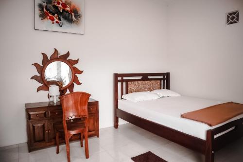 Tempat tidur dalam kamar di Tropical Paradiso Homestay