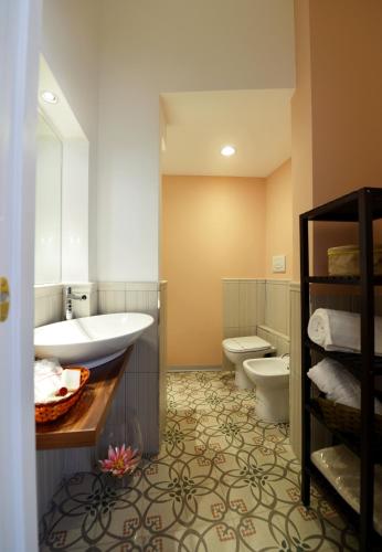 a bathroom with a sink and a toilet at *1*7*4* Via Roma in Palermo