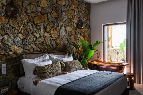 Ένα ή περισσότερα κρεβάτια σε δωμάτιο στο Charisma Hotel and Wellness Club