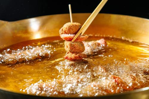 a pot of food with chop sticks in it at Shin Osaka Esaka Tokyu REI Hotel in Suita