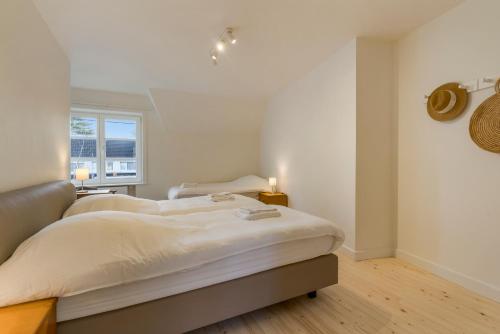 En eller flere senge i et værelse på Chalet des Roses - Fantastic & renewed Villa 7p