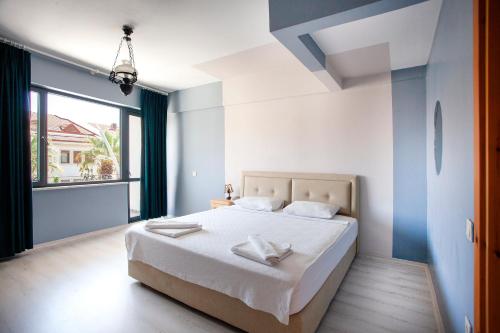 Postel nebo postele na pokoji v ubytování Zephyros City Otel
