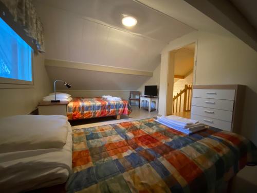 Postel nebo postele na pokoji v ubytování Hotel Aakenus Holiday Home Santa