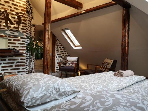 a bedroom with a bed and a brick wall at Gramophone Sofia Downtown Apartment in Sofia