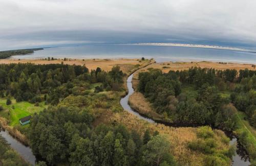an aerial view of a river and a lake at Pärli puhkemaja / Pearl riverside house in Pudisoo