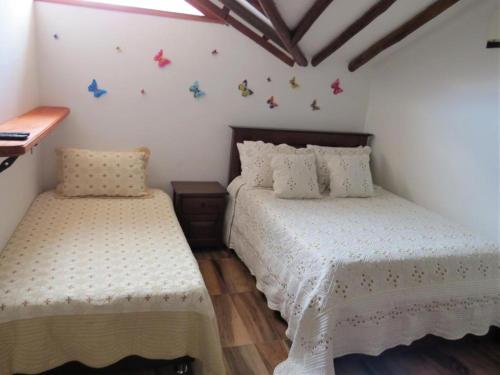Een bed of bedden in een kamer bij Hotel Aamayu