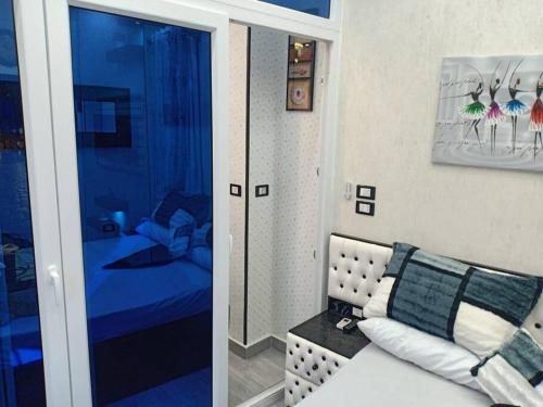 a living room with a couch and a bed at Oasis resort-Nice Condo -B31-Al Ahyaa - Hurghada in Hurghada