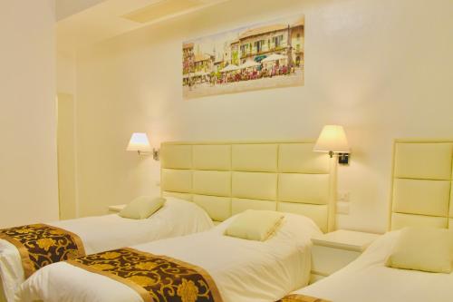 Postel nebo postele na pokoji v ubytování Hotel 900 Toscana