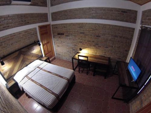 Katil atau katil-katil dalam bilik di Jardín Café Hotel & Restaurant