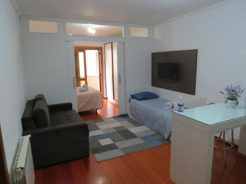 Postel nebo postele na pokoji v ubytování Apartamento Paraíso Gramado - 900m da Rua Coberta