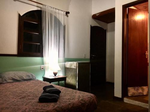 Un ou plusieurs lits dans un hébergement de l'établissement Casa Vermelha Búzios