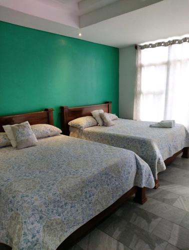 Ліжко або ліжка в номері Pura vida apartments