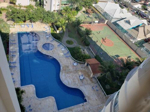 an overhead view of a swimming pool and a basketball court at Condomínio Encantador (Blue das Americas) in Rio de Janeiro