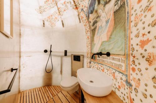 a bathroom with a toilet and a sink at Malešov Camp in Malešov
