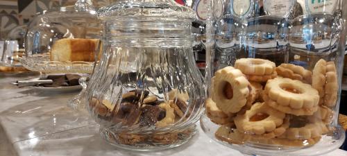 a glass jar filled with different types of cookies at Casa Lady in Garda