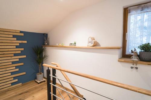 a staircase in a room with blue and white walls at Ferienhaus Leite Häusl in Sankt Jodok am Brenner