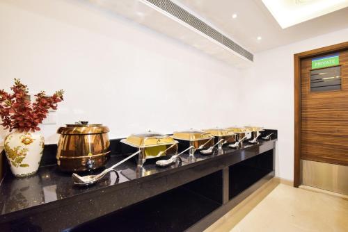 a kitchen with a bunch of drums on a counter at SureStay by Best Western Heritage Walk in Amritsar
