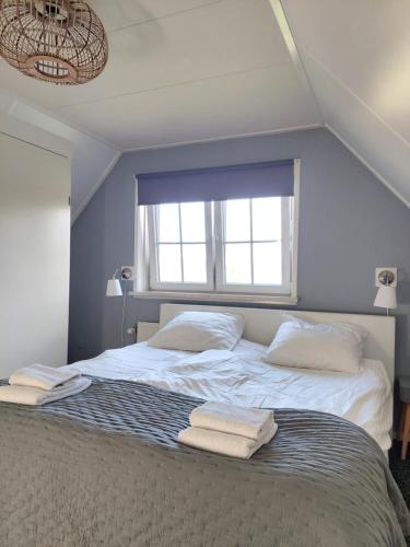 Katil atau katil-katil dalam bilik di Het Kottens Huisje