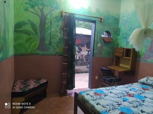 Postel nebo postele na pokoji v ubytování Chez Yaya - Chambre Brousse