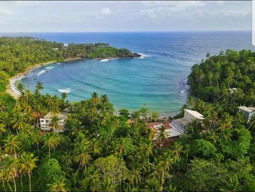 an aerial view of a beach in the ocean at Sea Port Hiriketiya in Hiriketiya