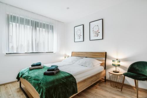 Posteľ alebo postele v izbe v ubytovaní Apartament Na Borach I SPA