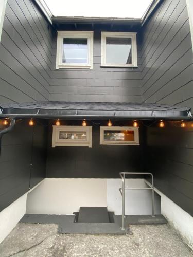a house with a solarium with lights on it at lovely UNDERGROUND flat ÅNDALSNES in Åndalsnes