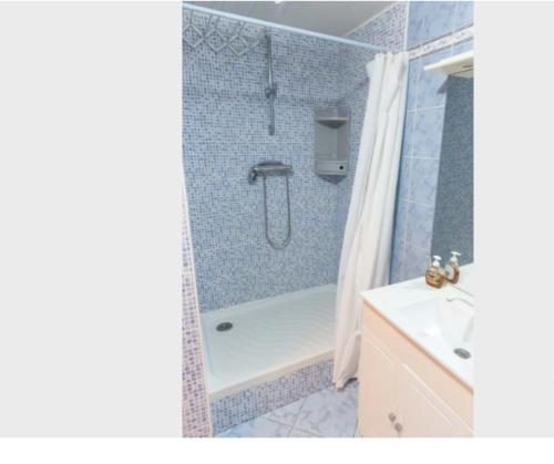 a bathroom with a shower and a tub and a sink at Studio calme et éclairé proche de Nation C in Paris