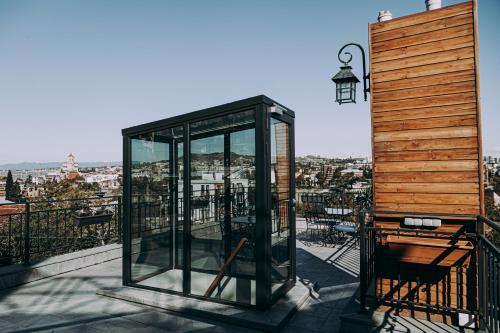 a phone booth on top of a balcony at Hotel Winoterra in Tbilisi City