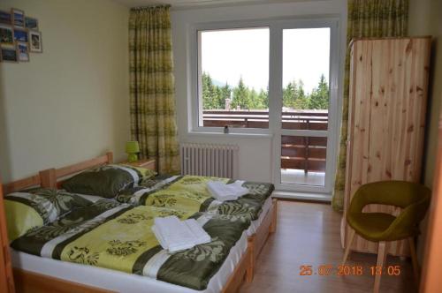 Postel nebo postele na pokoji v ubytování Apartmán Pleso, Štrbské Pleso