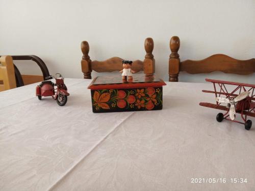 three toy toys are sitting on top of a bed at Sea view Dilesi in Dhílesi