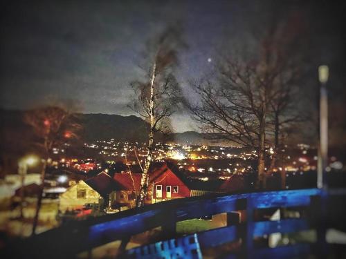 a view of a city at night with lights at CONTELE VLADIMIR in Bran
