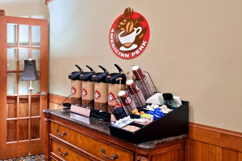a group of baseball bats sitting on top of a table at AmericInn by Wyndham Omaha in Omaha