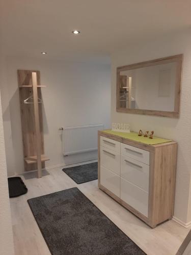 a room with a vanity and a mirror on the wall at Ferienhaus Schmalkalden in Schmalkalden