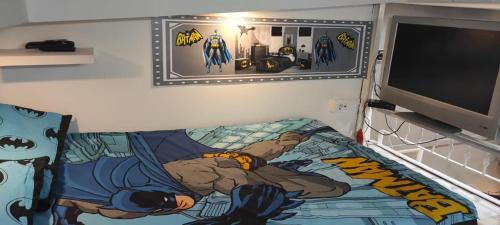a bedroom with a bed with a spider man painted on it at Batman Airport Catania City in Catania