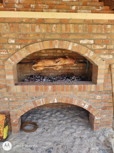 a brick oven with a turkey inside of it at Brvnara Maljkovic Drina 
