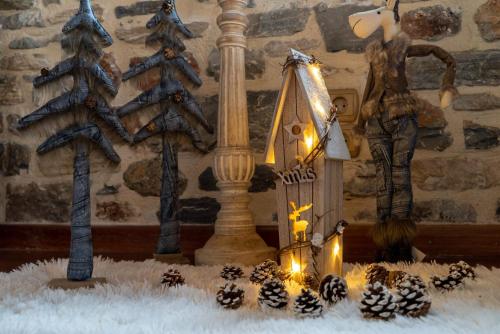 a christmas display with christmas trees and lights at Helene Eco Luxury Villa in Tsagarada