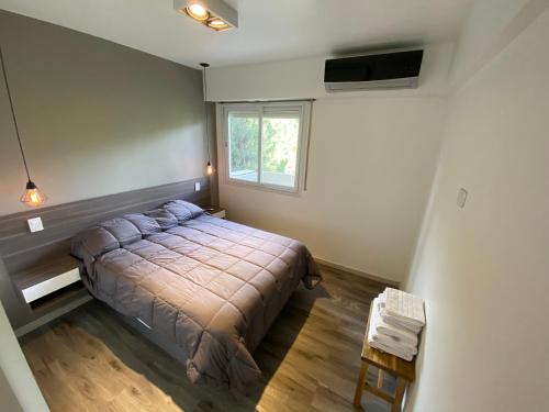 Buenaventura Apartments PARQUE tesisinde bir odada yatak veya yataklar