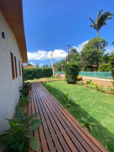 a wooden walkway in front of a house at Pousada Maresia in Fernando de Noronha