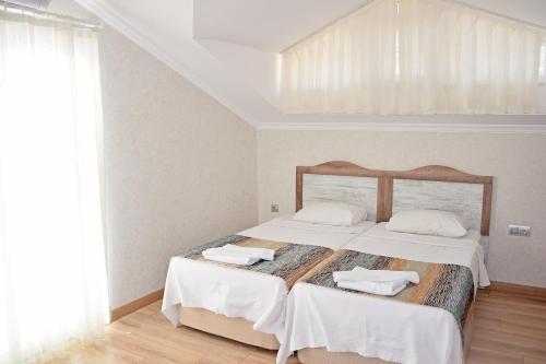 Postel nebo postele na pokoji v ubytování Villa Melis