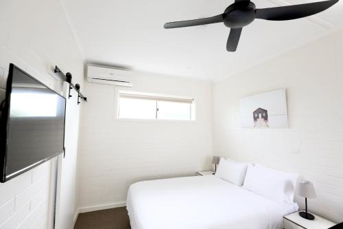 Ένα ή περισσότερα κρεβάτια σε δωμάτιο στο Guichen Bay Motel