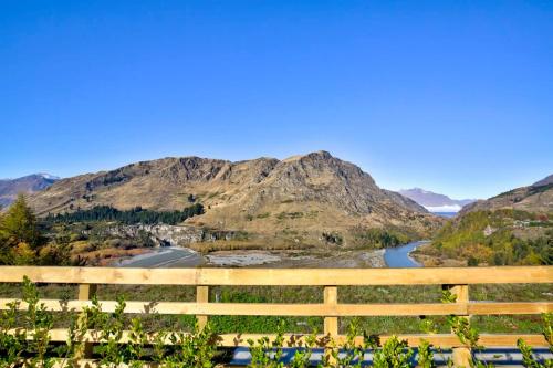 a view of a river with mountains in the background at Aroha Apartment at the base of Coronet Peak in Queenstown