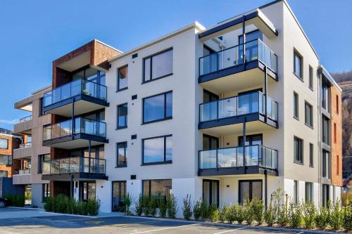 an image of an apartment building with balconies at Aroha Apartment at the base of Coronet Peak in Queenstown